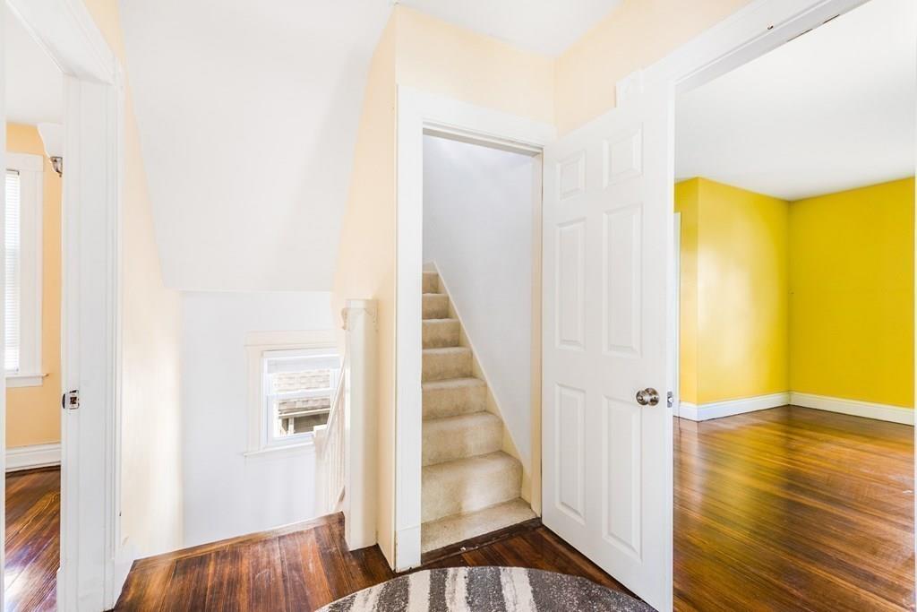 35 Trillium Street Springfield, MA 01108 - Photo 32 of 39 a view of a room with wooden floor and staircase