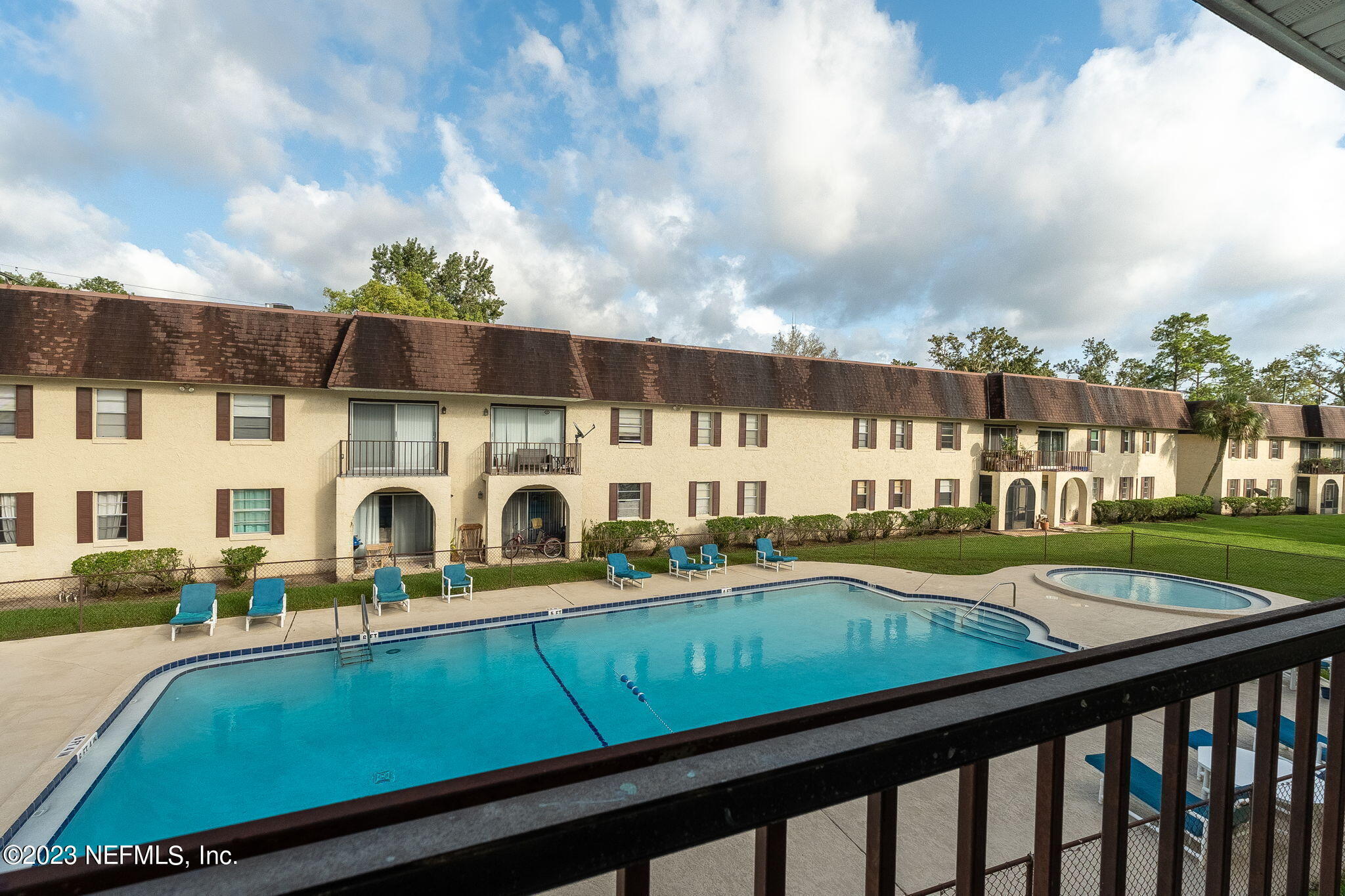 1735 El Camino Road, Unit 5 Jacksonville, FL 32216 - Photo 1 of 26 a view of swimming pool with outdoor seating