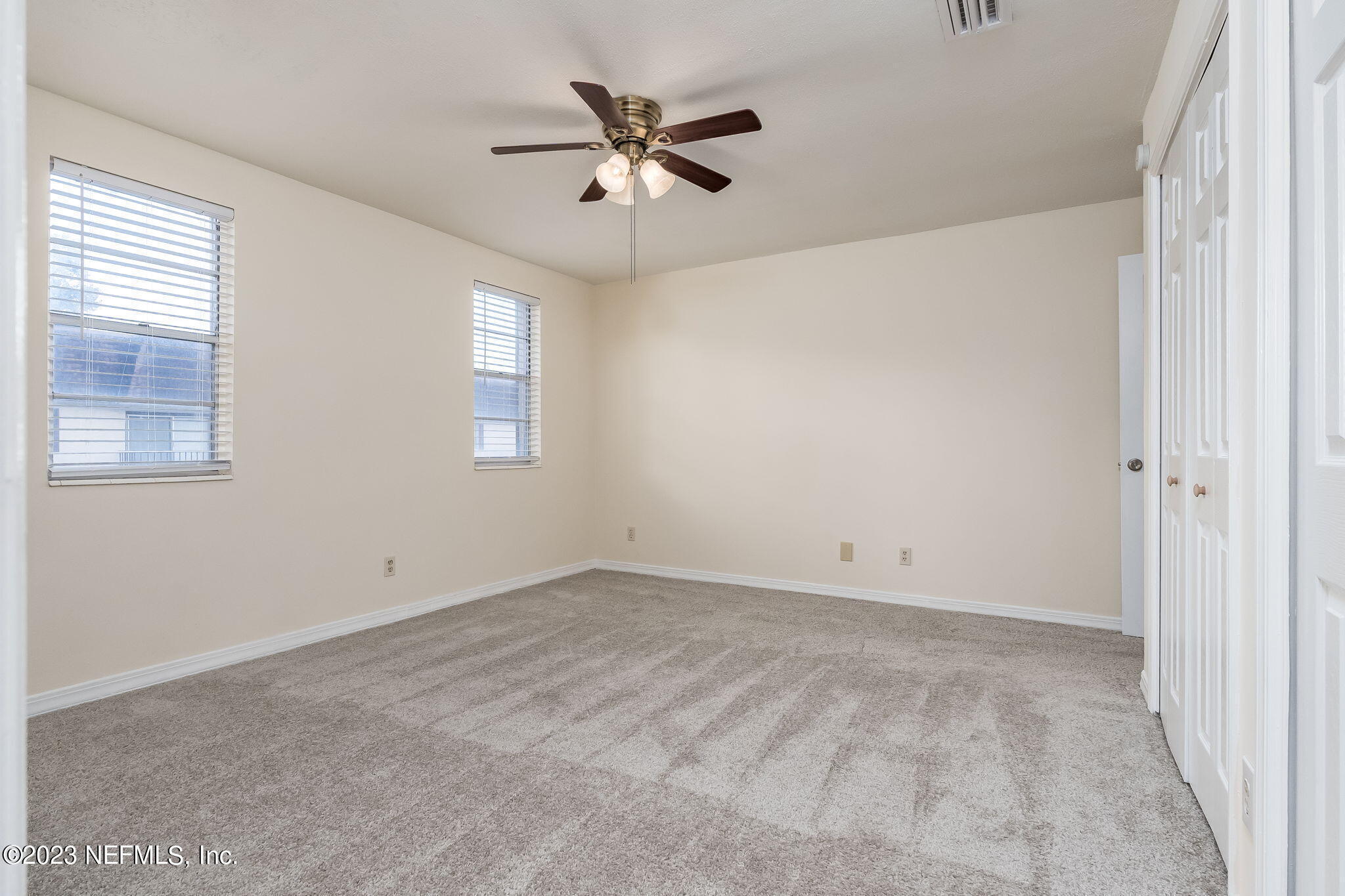 1735 El Camino Road, Unit 5 Jacksonville, FL 32216 - Photo 12 of 26 an empty room with closet and windows