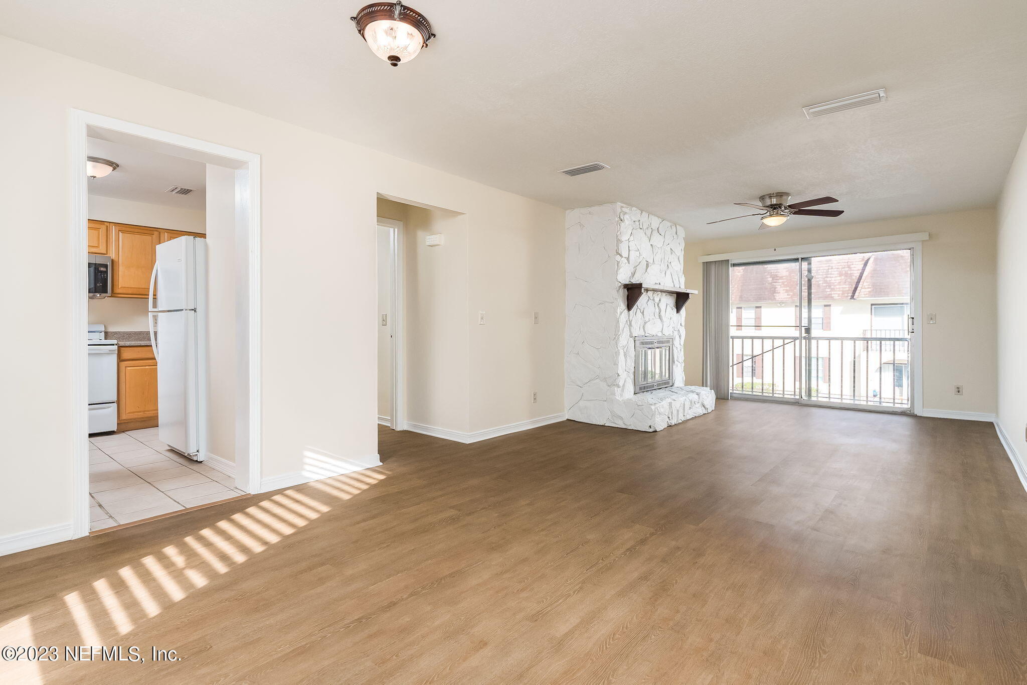1735 El Camino Road, Unit 5 Jacksonville, FL 32216 - Photo 5 of 26 a view of an empty room with wooden floor and a window
