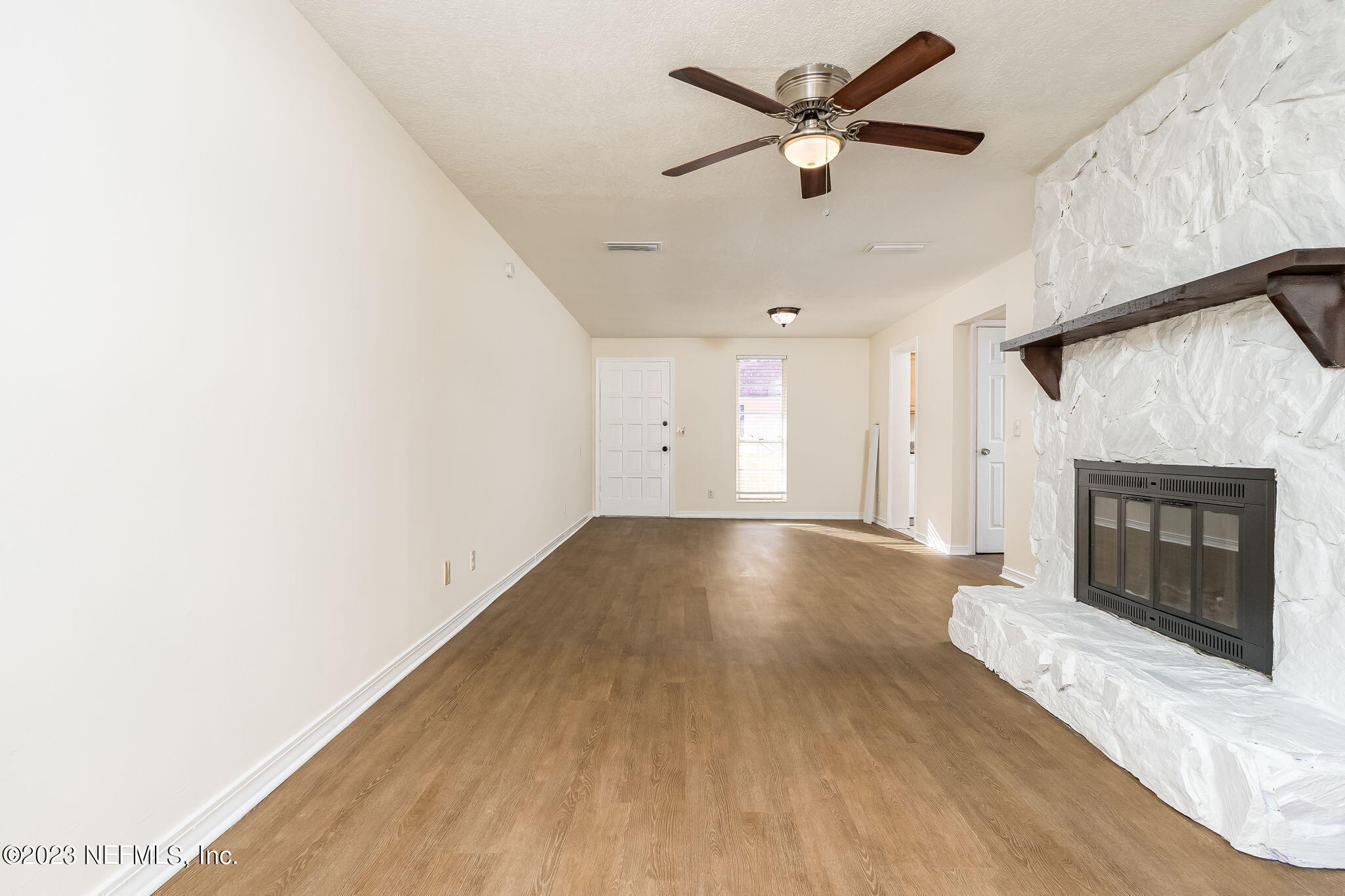1735 El Camino Road, Unit 5 Jacksonville, FL 32216 - Photo 6 of 26 a view of a livingroom with a fireplace and wooden floor