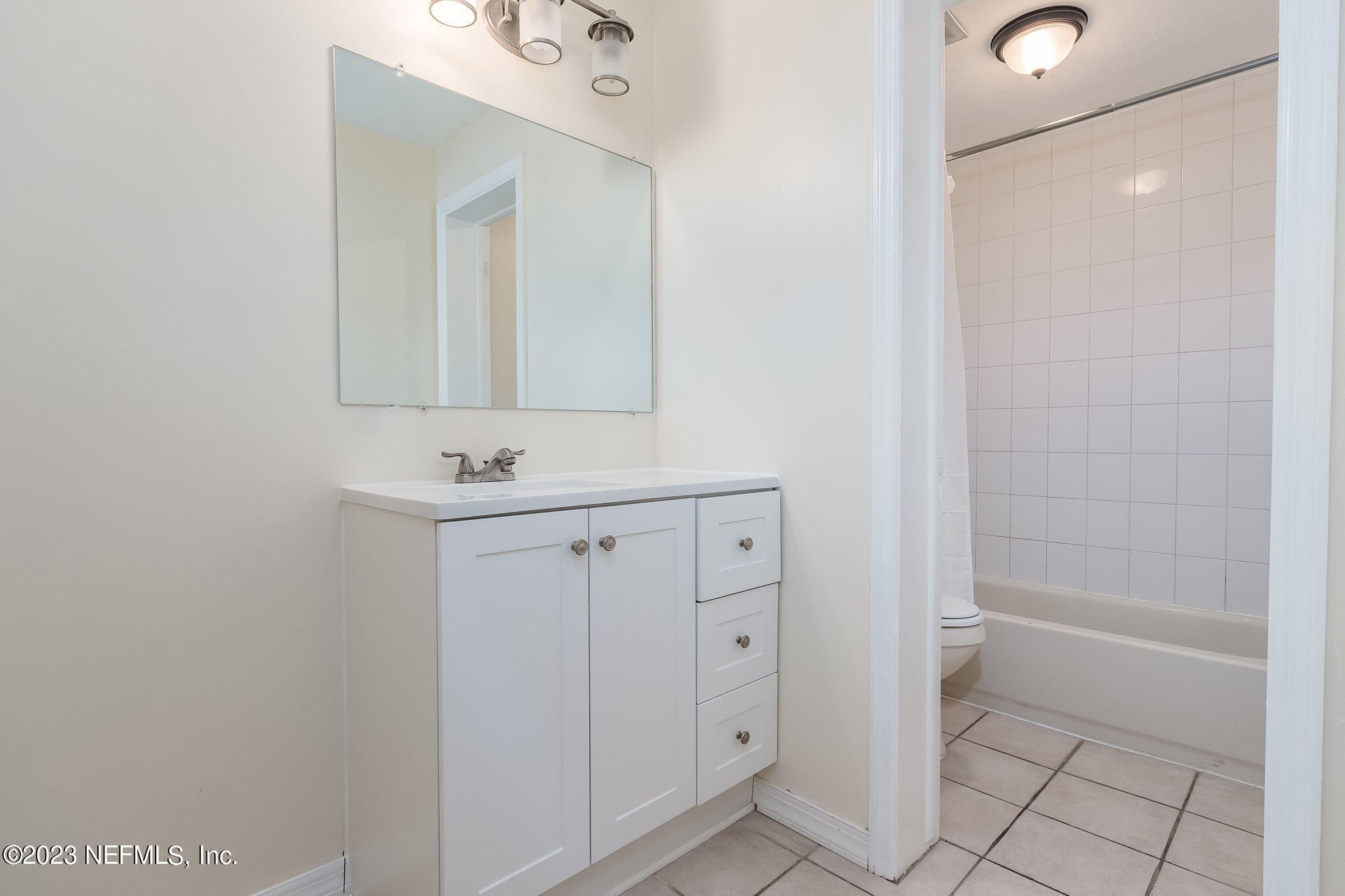 1735 El Camino Road, Unit 5 Jacksonville, FL 32216 - Photo 8 of 26 a bathroom with a sink a toilet and shower