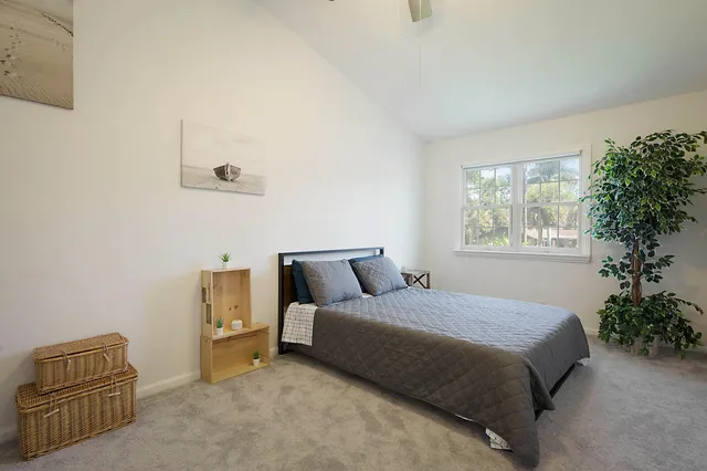 a bedroom with a bed and a couch