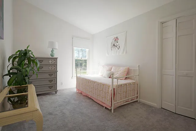 a room with a bed and a window