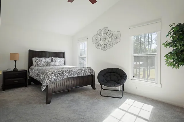 a bedroom with a bed and window