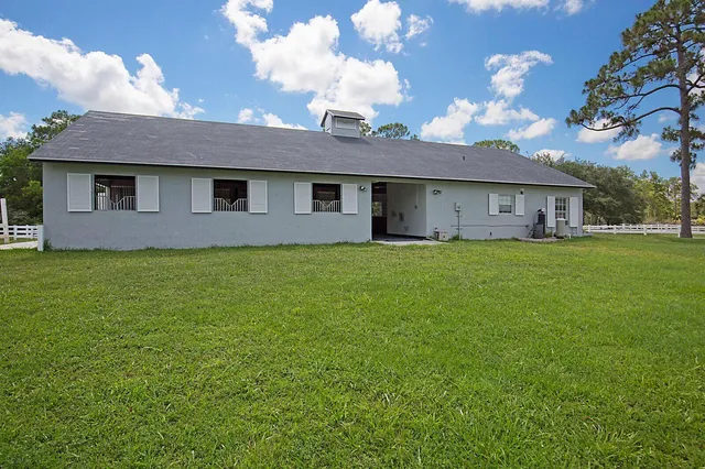 a view of a room with rug and window