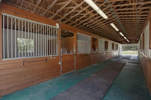 a bathroom with a toilet and a mirror