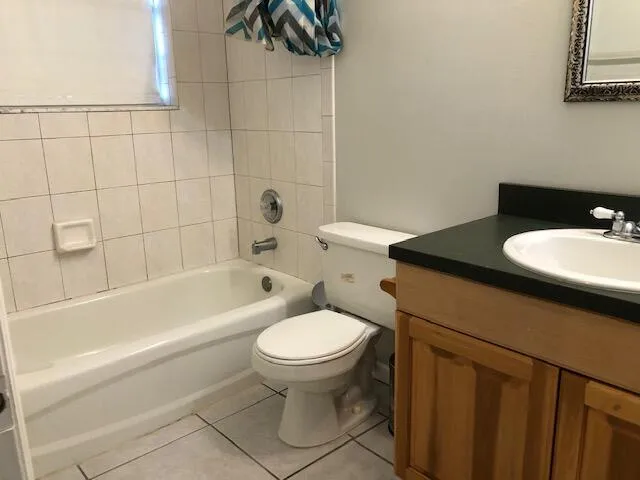 a view of a backyard with plants and a patio