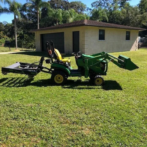 a view of a porch with a door and wooden floors