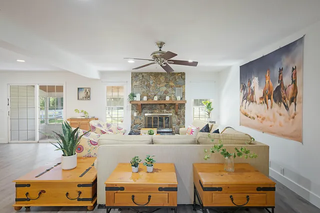 a living room with furniture and a fireplace