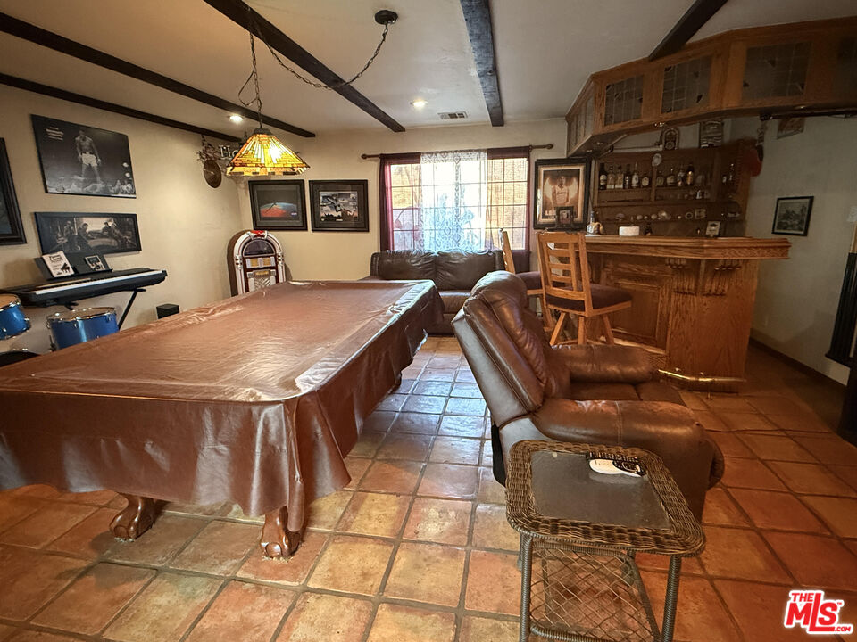 33931 Hanawalt Road Agua Dulce, CA 91390 - Photo 14 of 22 a dinning table and chairs in a room