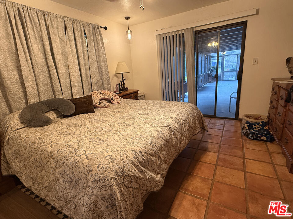 33931 Hanawalt Road Agua Dulce, CA 91390 - Photo 15 of 22 a bedroom with a bed and a shower