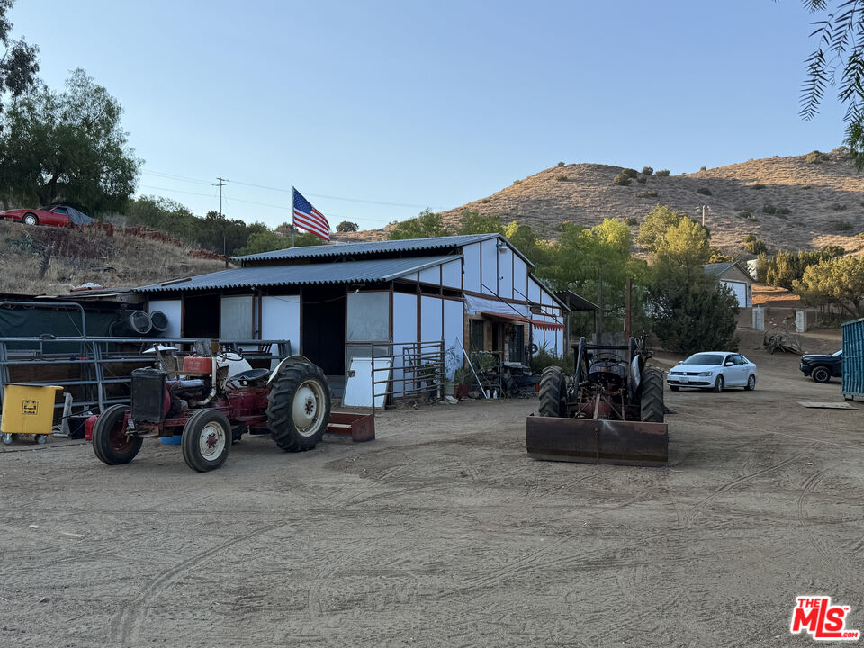 33931 Hanawalt Road Agua Dulce, CA 91390 - Photo 18 of 22 a view of a car park in front of house