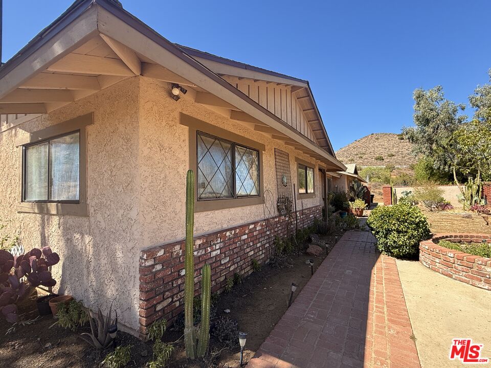 33931 Hanawalt Road Agua Dulce, CA 91390 - Photo 2 of 22 a front view of a house