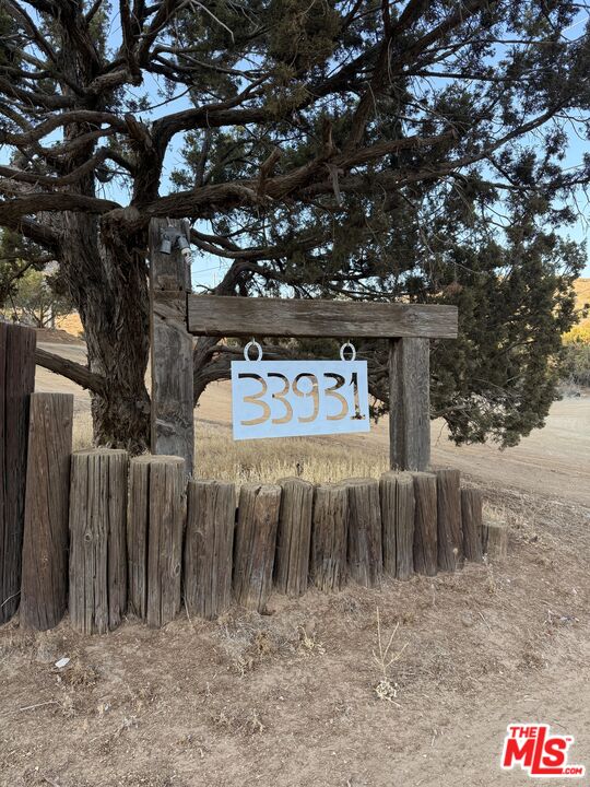 33931 Hanawalt Road Agua Dulce, CA 91390 - Photo 22 of 22 a front view of a house with a yard