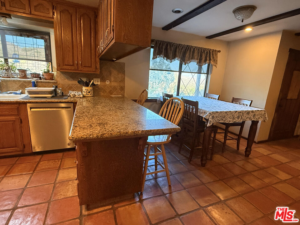33931 Hanawalt Road Agua Dulce, CA 91390 - Photo 8 of 22 a view of a dining room with furniture and window