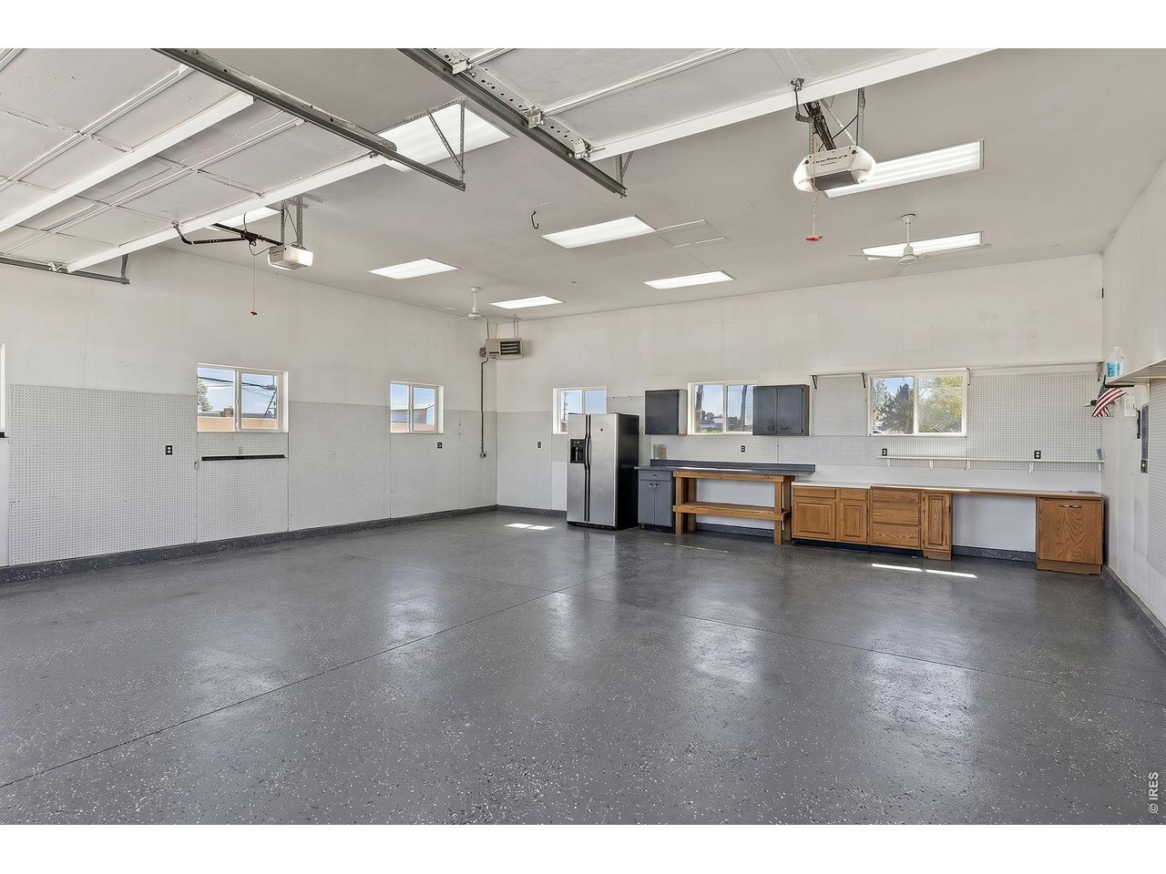 2002 Trail Ridge Drive Severance, CO 80615 - Photo 38 of 50 One of the standout features is the fully finished and heated 1,080 sq ft shop (34 ft X 32 ft), perfect for projects, storage, or a true hobby space. Shop has 220 AMP service. Shop has epoxy coating.