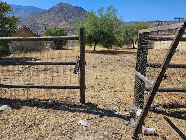 a view of a balcony with wooden floor and a mountain view