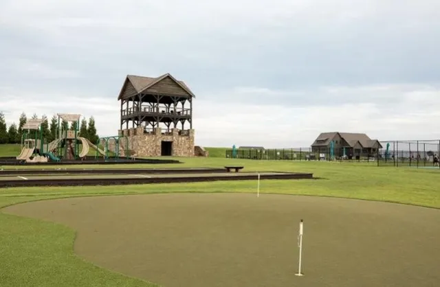 a view of a golf course with a lake