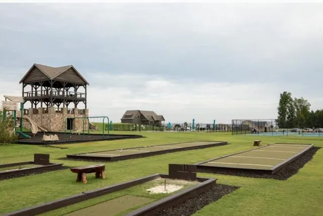 a front view of a house with a park
