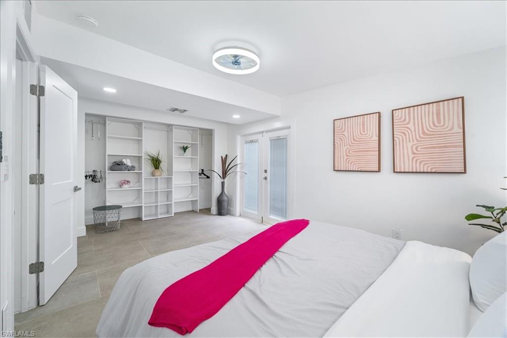 2123 Holiday Lane Naples, FL 34104 - Photo 19 of 43 Bedroom featuring recessed lighting and french doors