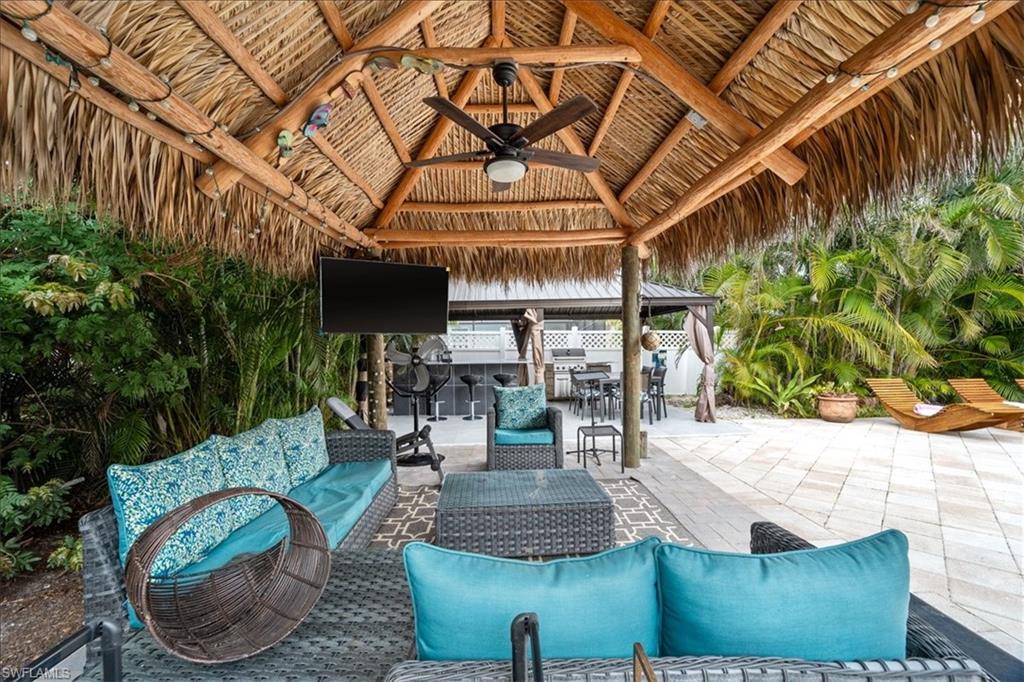 2123 Holiday Lane Naples, FL 34104 - Photo 27 of 43 View of patio / terrace with ceiling fan and an outdoor living space