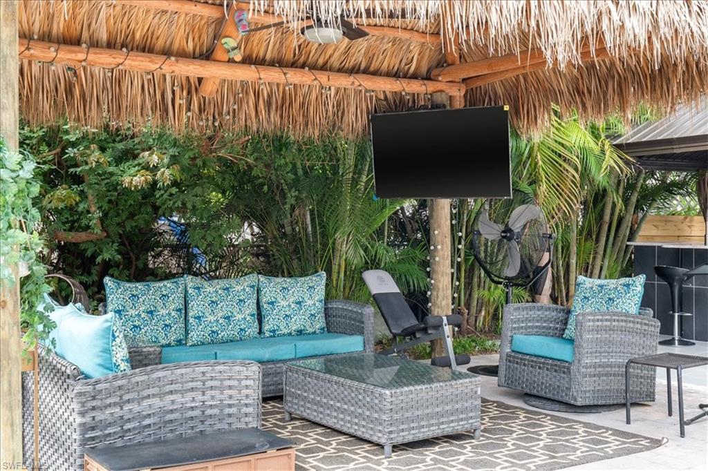 2123 Holiday Lane Naples, FL 34104 - Photo 29 of 43 a view of a backyard with plants and a patio