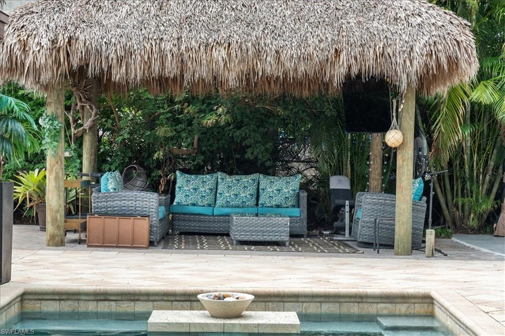 2123 Holiday Lane Naples, FL 34104 - Photo 40 of 43 Outdoor pool with a patio area, a gazebo, and outdoor lounge area