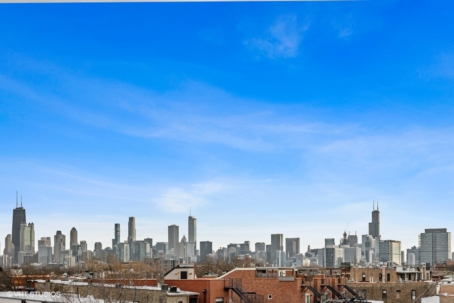 2107 North Kenmore Avenue Chicago, IL 60614 - Photo 2 of 7 a view of a city with tall buildings in the background