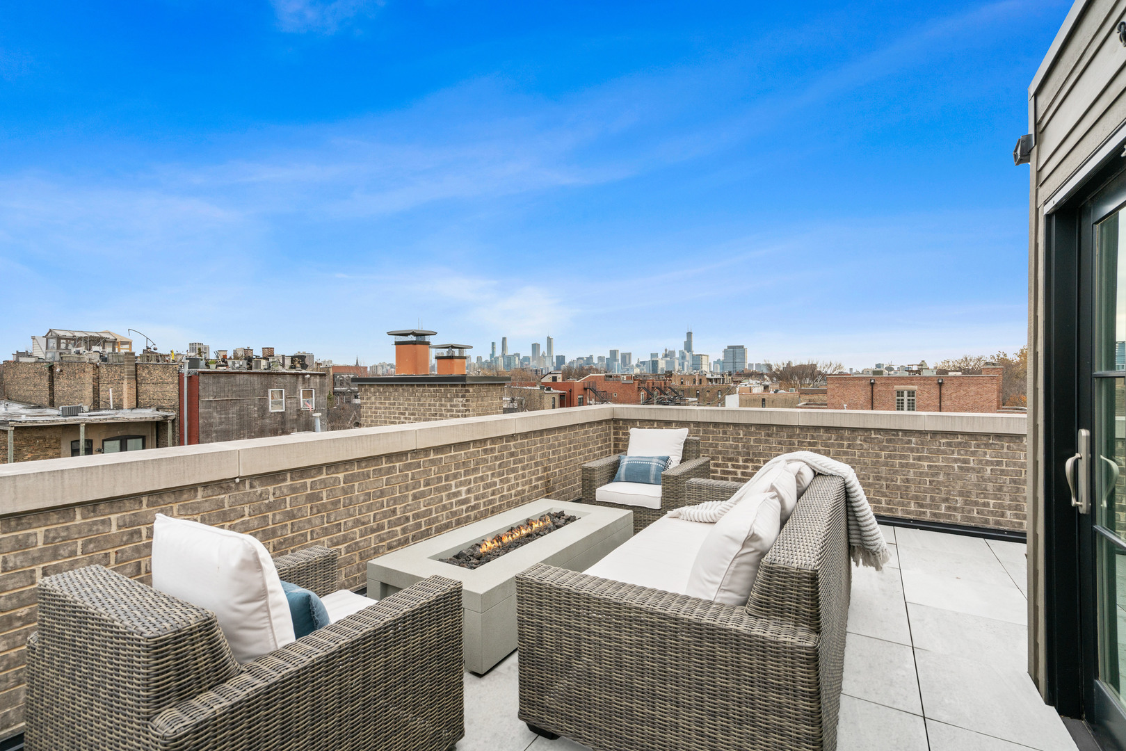 2107 North Kenmore Avenue Chicago, IL 60614 - Photo 3 of 7 a view of roof deck with seating space and barbeque oven