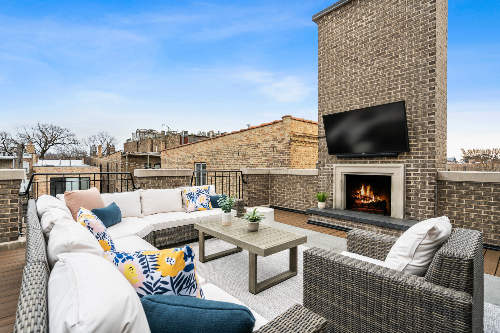 2107 North Kenmore Avenue Chicago, IL 60614 - Photo 5 of 7 a outdoor space with patio fireplace couches and a fireplace