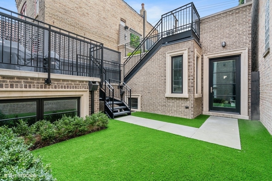 2107 North Kenmore Avenue Chicago, IL 60614 - Photo 7 of 7 a view of an house with backyard porch and garden