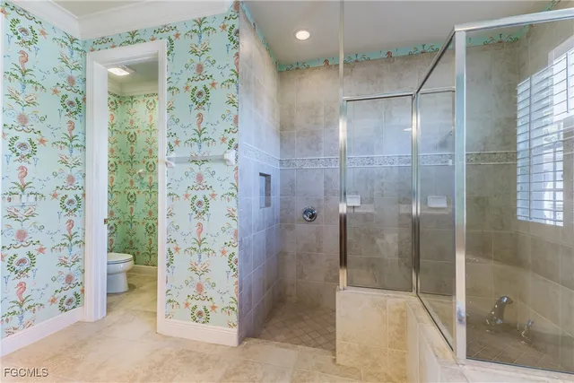 a bathroom with a shower and a sink