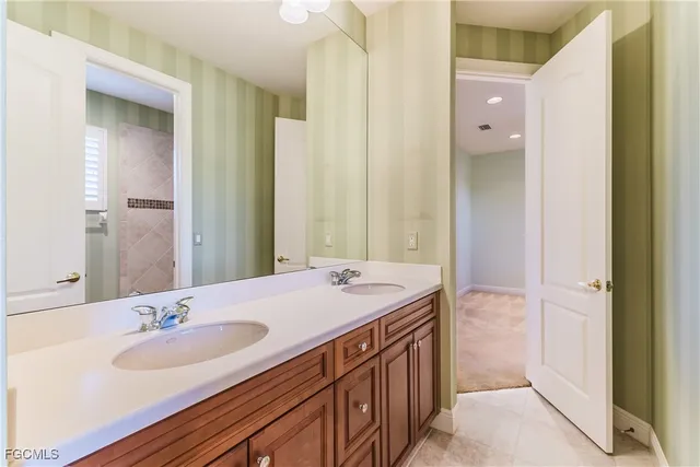 a bathroom with a sink and a mirror