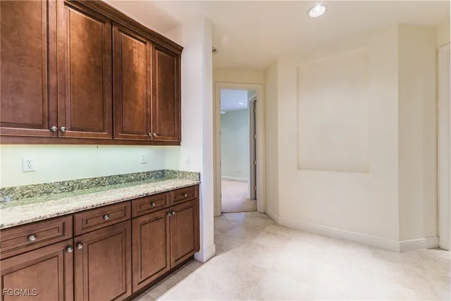 an empty room with wooden floor