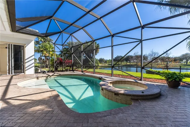 a view of a swimming pool with a yard