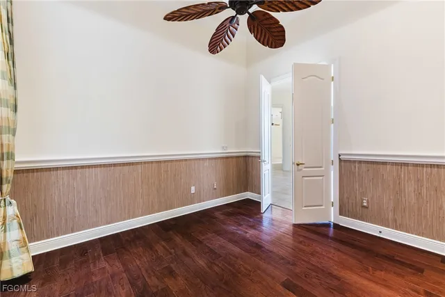 an empty room with wooden floor