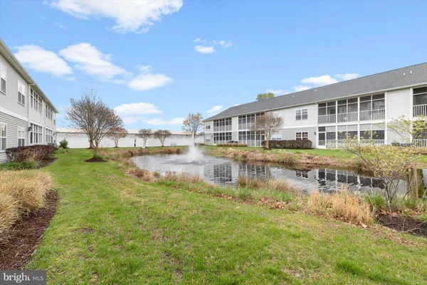 a view of a lake with a building in the background