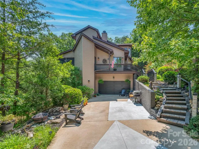 a view of house with outdoor seating area