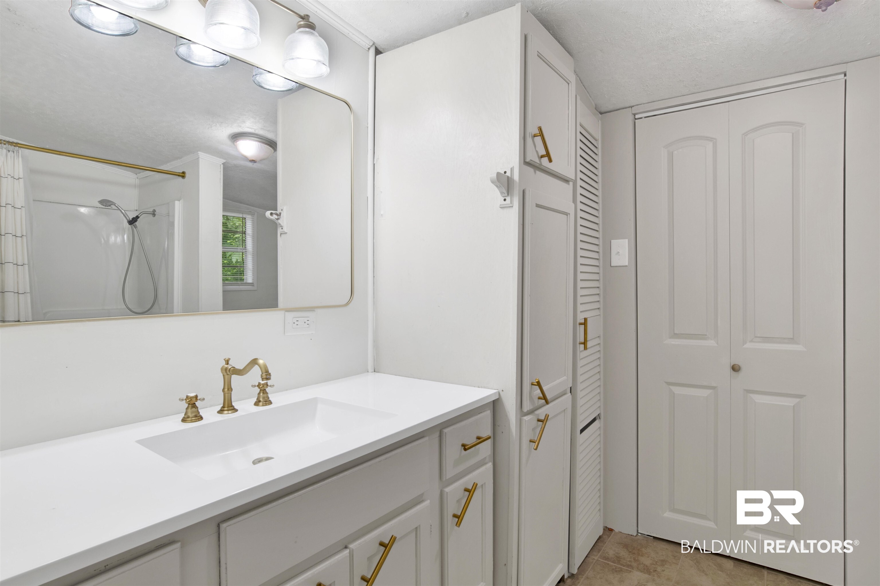 4265 Greaves Road Eight Mile, AL 36613 - Photo 15 of 34 Bathroom with a closet, vanity, a shower with shower curtain, and tile patterned floors