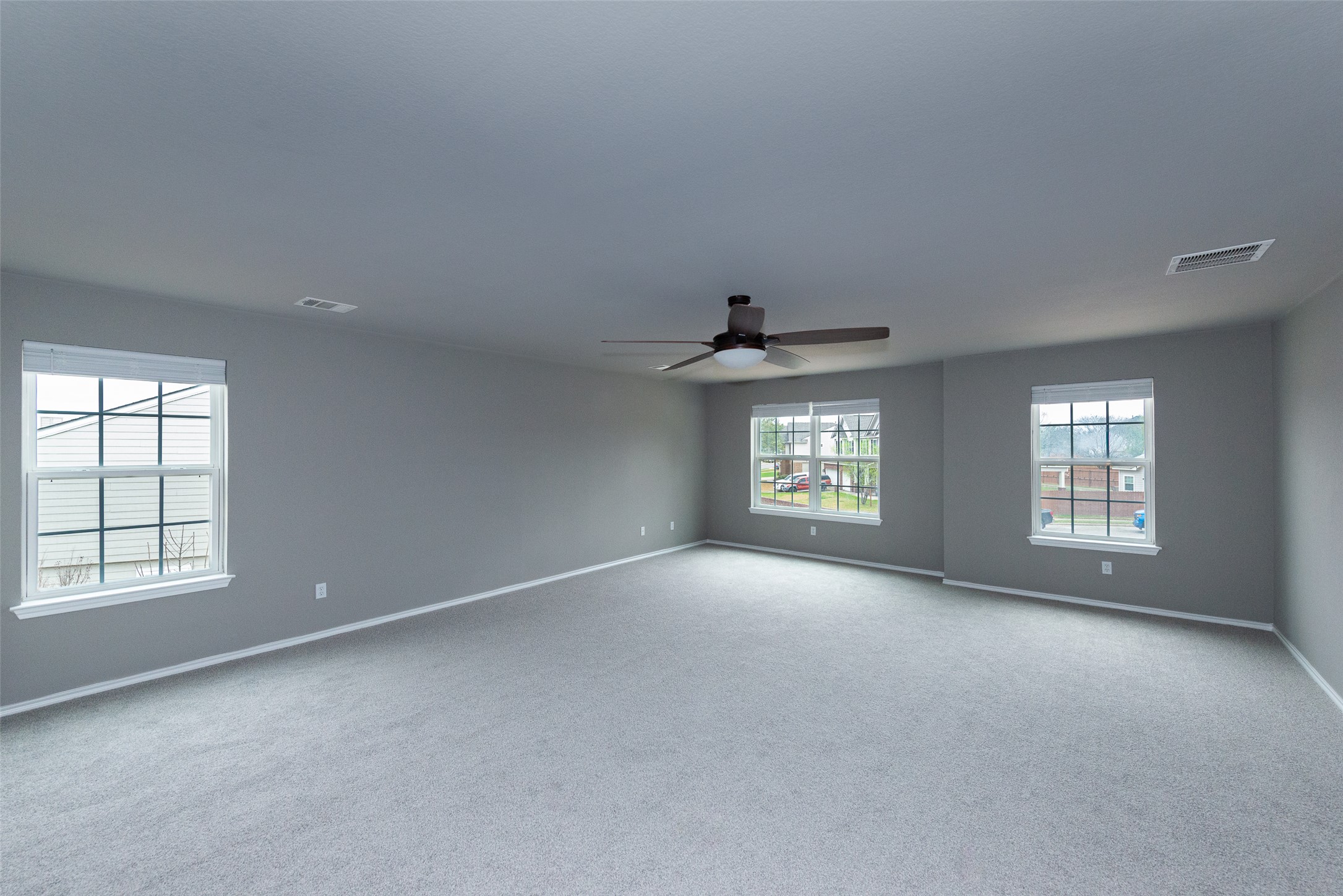 184 Tulip Cove Kyle, TX 78640 - Photo 18 of 40 an empty room with a window and windows