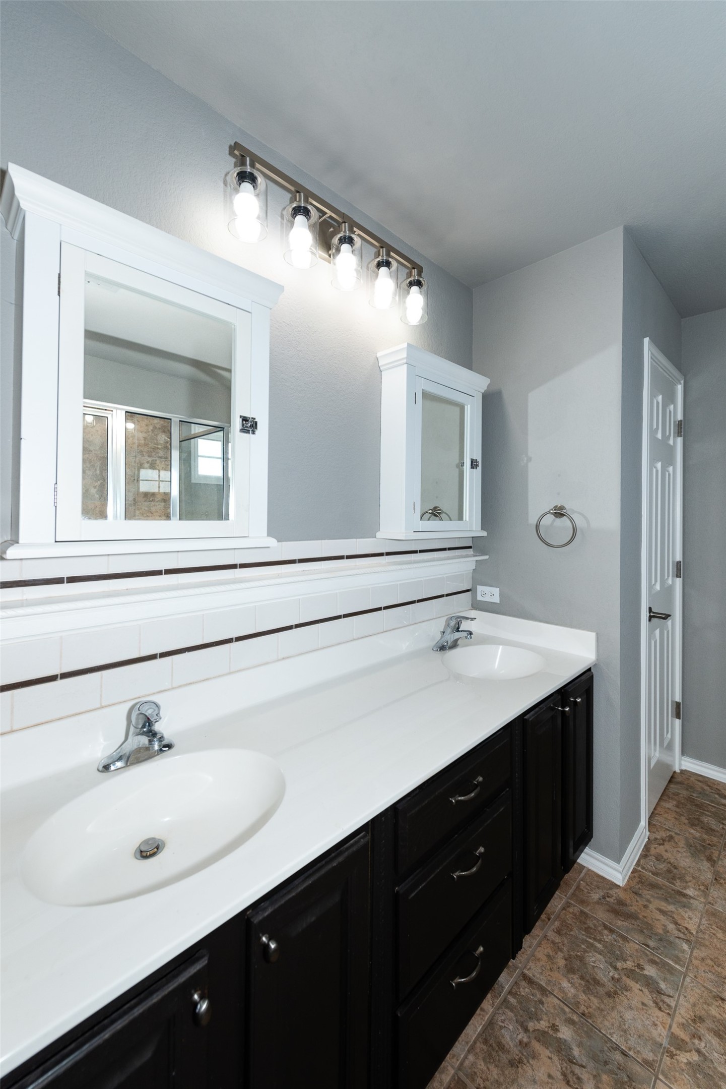 184 Tulip Cove Kyle, TX 78640 - Photo 20 of 40 a bathroom with a sink double vanity and a mirror