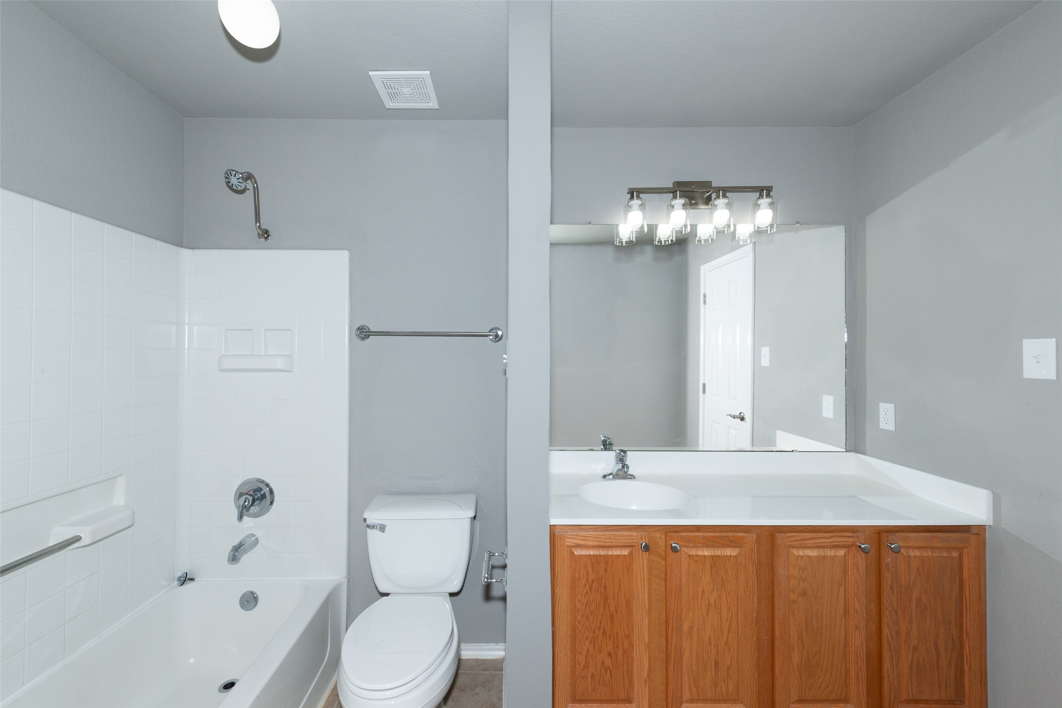 184 Tulip Cove Kyle, TX 78640 - Photo 25 of 40 a bathroom with a sink a toilet and shower