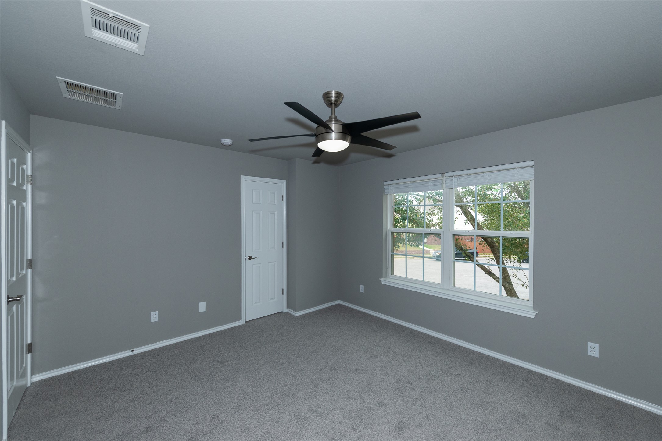 184 Tulip Cove Kyle, TX 78640 - Photo 27 of 40 a view of an empty room with a window