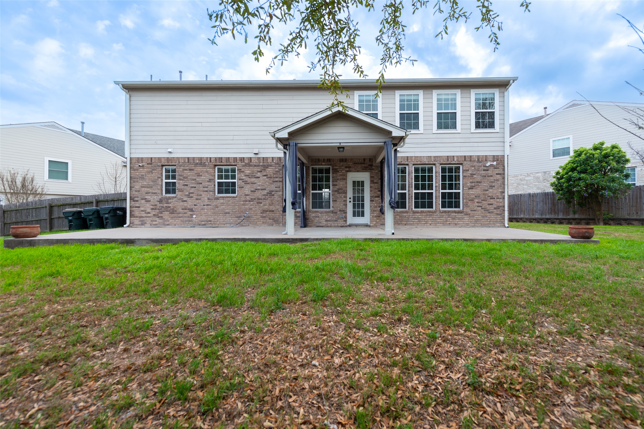 184 Tulip Cove Kyle, TX 78640 - Photo 29 of 40 a front view of house with yard and outdoor seating