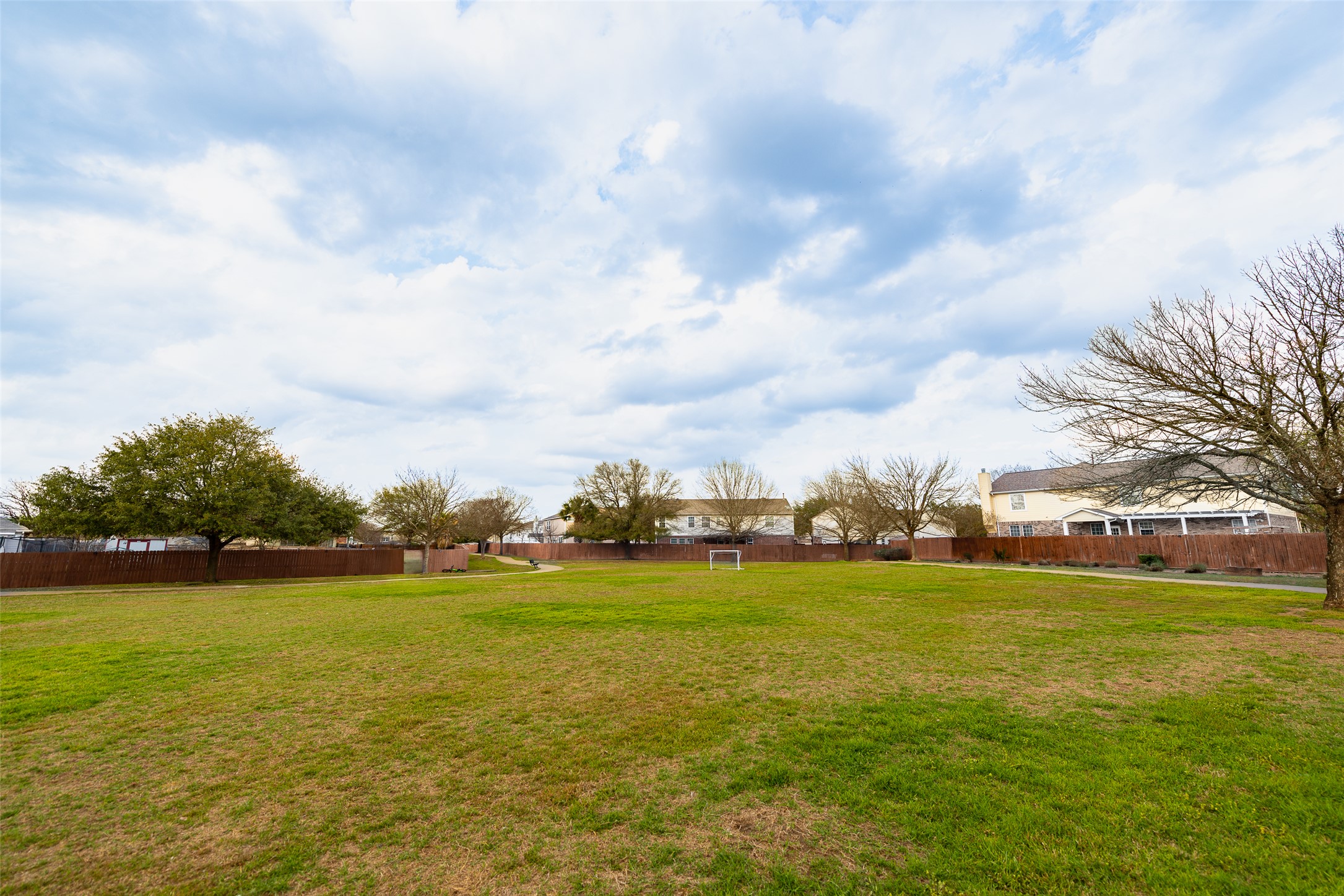 184 Tulip Cove Kyle, TX 78640 - Photo 40 of 40 a view of a lake with houses in the background