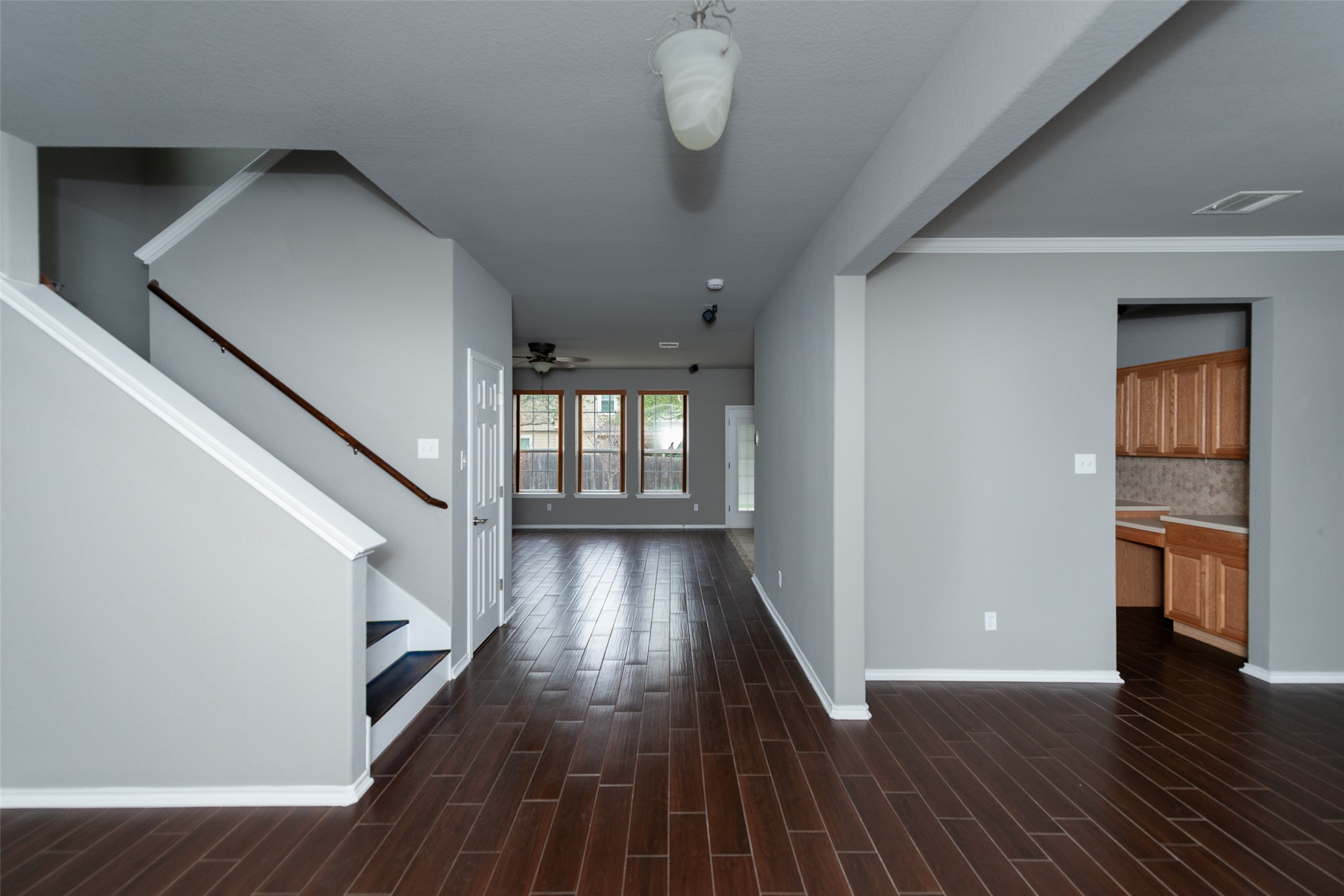 184 Tulip Cove Kyle, TX 78640 - Photo 5 of 40 a view of entryway with wooden floor