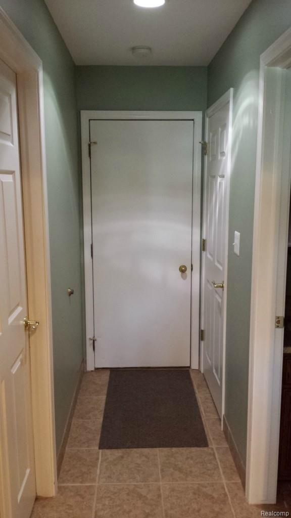 73390 McFadden Road Armada, MI 48005 - Photo 20 of 38 21 Hallway to Garage, Laundry, Bath, Basement.jpg