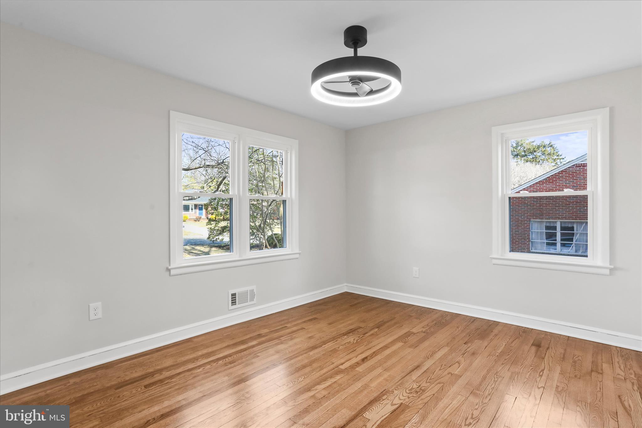 10 Linden Boulevard Middletown, MD 21769 - Photo 11 of 28 a view of an empty room with window and wooden floor
