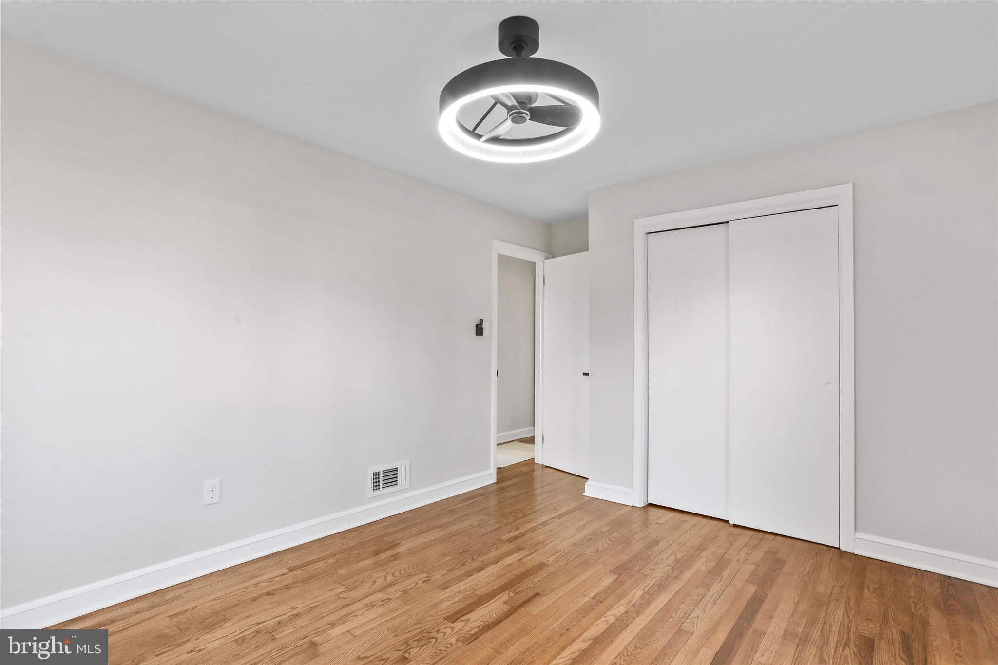 10 Linden Boulevard Middletown, MD 21769 - Photo 12 of 28 a view of an empty room and wooden floor